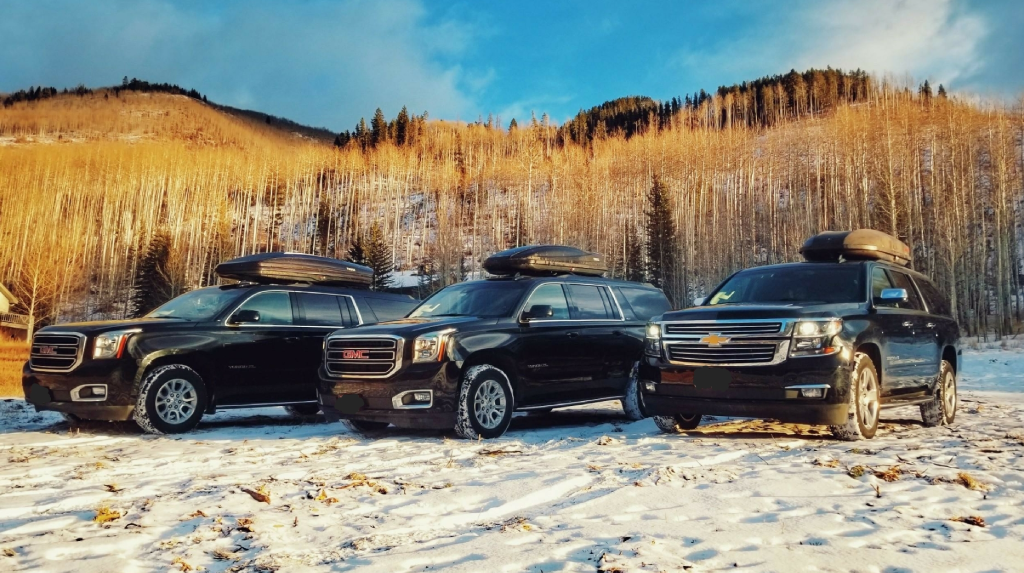 Luxury black car offering transportation from Denver Airport to Boulder